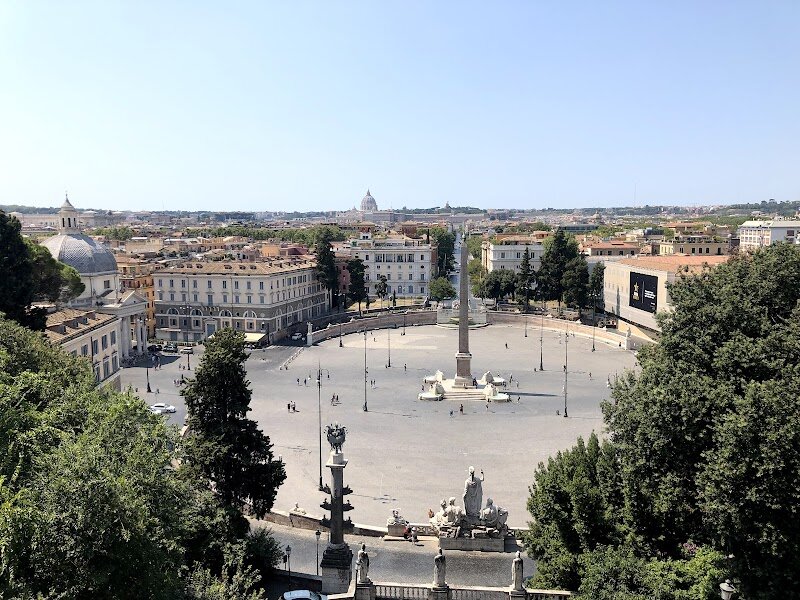 Passeggiata del Pincio - Passeggiata del Pincio, perched above the bustling Piazza del Popolo, is one of Rome’s most enchanting promenades—a place where history, beauty, and relaxation converge. Once called the “Hill of Little Gardens” by the ancient Romans, this leafy ridge was home to aristocratic villas and lush gardens, favored for centuries by nobles seeking tranquility and spectacular views. Today, families and curious travelers stroll its broad, tree-lined avenues, discovering marble busts of famous Italians, whimsical fountains, and colorful flowerbeds at every turn. The promenade’s neoclassical terraces, designed by architect Giuseppe Valadier in the early 19th century, were commissioned by Napoleon and transformed into Rome’s first public garden. At sunset, the Pincio Terrace offers breathtaking panoramas of Rome’s skyline—St. Peter’s Basilica, the distant Gianicolo Hill, and the city’s domes glowing in golden light. Children delight in open spaces and gardens, while adults appreciate the blend of art, nature, and history. Whether you’re seeking a peaceful escape, a family picnic, or a romantic stroll, Passeggiata del Pincio invites you to experience Rome as locals have for generations: with wonder, leisure, and a touch of imperial grandeur.
