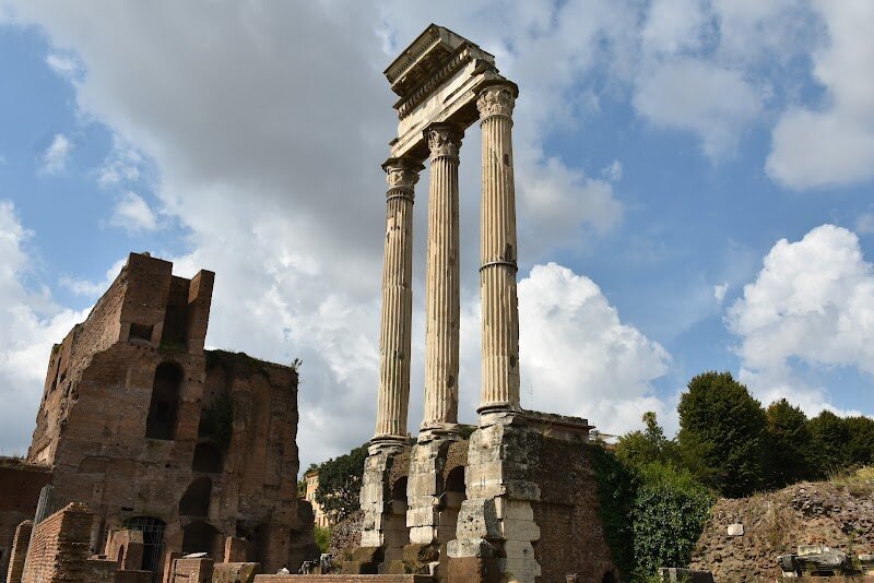 Temple of Castor and Pollux - Standing proudly in the heart of the Roman Forum, the Temple of Castor and Pollux offers a captivating glimpse into ancient Rome's legendary past. Built in 484 BC to honor the divine twin brothers who miraculously appeared on horseback during the Battle of Lake Regillus, this magnificent temple commemorates one of Rome's most thrilling mythological tales. According to legend, Castor and Pollux didn't just help secure victory—they galloped straight to the Forum afterward, watering their horses at the Spring of Juturna to announce Rome's triumph. The temple marks the very spot where these heroic twins materialized, making it a powerful symbol of divine protection and military success. Today, three towering Corinthian columns stand as silent witnesses to over two millennia of history. These impressive marble pillars, part of the temple rebuilt by Emperor Tiberius in 6 AD, showcase the grandeur of Roman architectural achievement. As you explore this iconic landmark, imagine the political meetings held here, the religious ceremonies celebrating the twin gods, and the annual festivals that once drew crowds of devoted Romans. It's a place where mythology and history beautifully intertwine, sparking imagination in visitors of all ages.