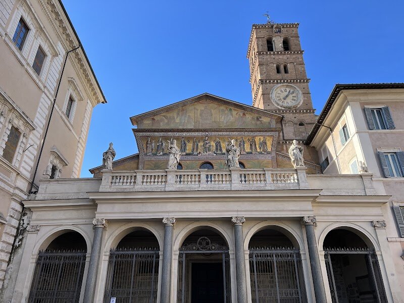 Basilica of Santa Maria in Trastevere - At the heart of Rome’s lively Trastevere district, the Basilica of Santa Maria in Trastevere stands as a radiant jewel—both spiritually and artistically—offering a vivid window into the city’s layered past. This is no ordinary church: tradition holds it may be the first in Rome dedicated to the Virgin Mary, with roots stretching back to a modest house-church founded by Pope Callixtus I in the early 3rd century, and later expanded in the 4th century by Pope Julius I. The basilica you see today, however, is a masterpiece of medieval architecture, rebuilt in the 12th century by Pope Innocent II on ancient foundations, blending centuries of history into one breathtaking space. Step inside, and you’ll be greeted by a dazzling interior: twenty-two soaring granite columns, salvaged from the Baths of Caracalla, frame the nave, while the apse glows with golden mosaics depicting Christ and the Virgin Mary, commissioned by Pope Innocent III. Families and curious travelers will marvel at the intricate medieval mosaics by Pietro Cavallini, whose naturalistic style marked a turning point in European art. The church’s legendary “Fons Olei”—a miraculous spring of oil said to have appeared at Christ’s birth—adds a touch of mystery and wonder, especially for young explorers. Outside, the bustling Piazza Santa Maria, with its iconic fountain and vibrant café culture, invites visitors to linger and soak up the local atmosphere. Whether you’re drawn by history, art, or simply the joy of discovery, Santa Maria in Trastevere offers an unforgettable experience—a living tapestry of faith, legend, and Roman life through the ages.
