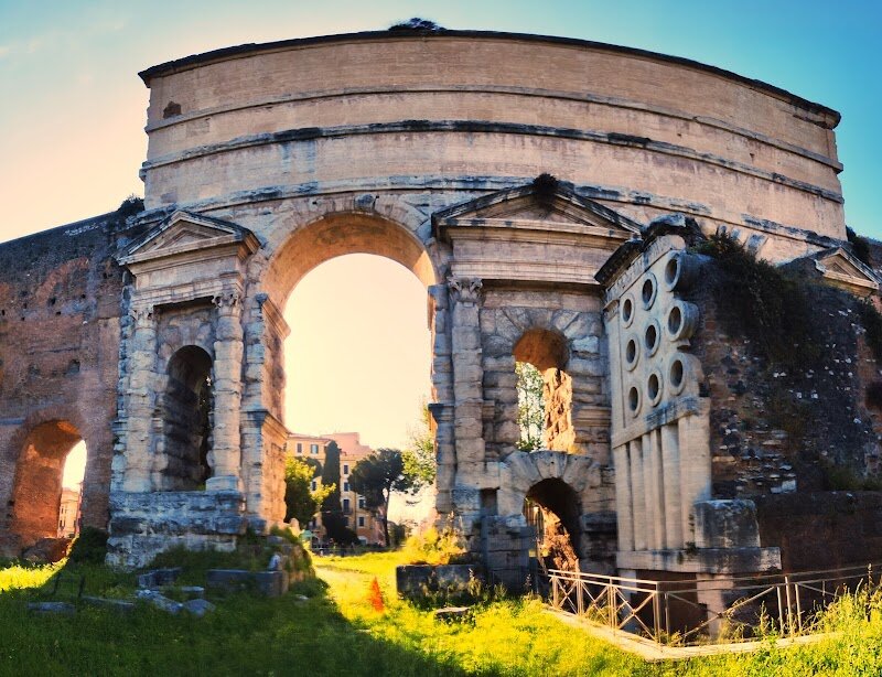 Porta Maggiore - Imagine stepping through a gateway that has witnessed centuries of history, engineering marvels, and the grandeur of the Roman Empire. Porta Maggiore, or the "Larger Gate," is a testament to Rome's ingenuity and architectural prowess. Built by Emperor Claudius in 52 AD, this monumental double archway was originally designed to support two impressive aqueducts, the Aqua Claudia and the Anio Novus. Later incorporated into the Aurelian Walls, it became a crucial entry point for travelers along the ancient Via Praenestina and Via Labicana. What makes Porta Maggiore truly special is its blend of functionality and aesthetics, showcasing Rome's mastery of water management and urban planning. Visitors can marvel at the intricate inscriptions and the stunning travertine structure, while exploring the surrounding vibrant streets filled with local shops and cafes. This historic site is perfect for families and curious travelers alike, offering a glimpse into Rome's rich past and its enduring cultural heritage. Whether you're a history buff or simply looking for a unique experience, Porta Maggiore is an unforgettable stop in the Eternal City.