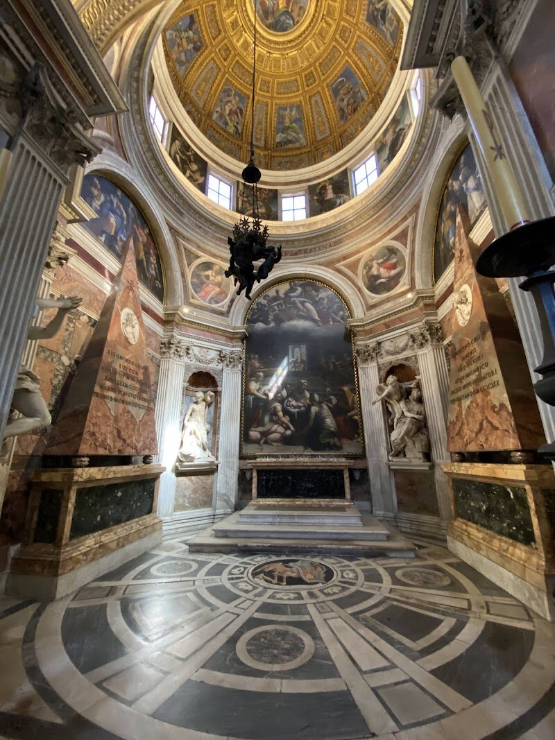 Cappella Chigi - Nestled within the stunning Santa Maria del Popolo church in Rome lies the breathtaking Cappella Chigi, a masterpiece of Renaissance and Baroque art. This chapel is a testament to the creative genius of Raphael, who designed it in the early 16th century for his patron, Agostino Chigi. What makes this place truly special is its unique blend of styles, as Gian Lorenzo Bernini later added his own Baroque flair, creating a harmonious fusion of artistic traditions. The chapel's octagonal shape, adorned with vibrant marbles and ornate sculptures, is a visual feast. Visitors can marvel at the intricate mosaics in the dome, designed by Raphael to evoke a sense of celestial wonder. As you explore this treasure trove of art and history, you'll uncover the stories of the Chigi family and the artistic innovations that have made this chapel a must-visit destination for families and curious travelers alike.