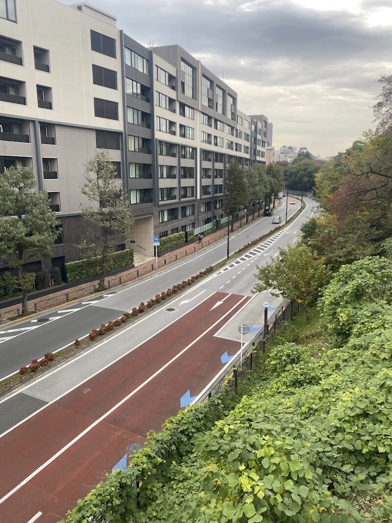 Aoyama Cemetery - Aoyama Cemetery in Tokyo is a rare blend of history, beauty, and quiet reflection, making it a fascinating destination for families and curious travelers alike. Established in 1872 as Japan’s first public cemetery, it was originally reserved for nobility before opening to the public, and today it serves as the final resting place for many of Japan’s most influential figures, including statesmen like Ōkubo Toshimichi and beloved icons such as Hachikō, the famously loyal dog. Wandering the peaceful paths, visitors will discover gravestones of writers, artists, Olympic heroes, and foreign pioneers who helped shape modern Japan. The cemetery’s “Gaijin Bochi” (Foreign Section) is especially intriguing, offering stories of doctors, diplomats, and engineers from abroad who made lasting contributions during the Meiji era. Aoyama Cemetery is also celebrated for its cherry blossoms. In spring, the grounds are transformed by rows of sakura trees, drawing families and locals for hanami (cherry blossom viewing) amidst a serene, cityscape backdrop. Whether you come for the history, the beauty, or a tranquil stroll, Aoyama Cemetery offers a unique and memorable glimpse into Tokyo’s past and present.