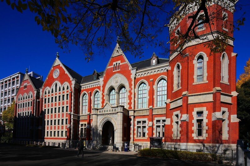 Keio University - Keio University, nestled in the vibrant heart of Tokyo, is more than just Japan’s oldest private university—it’s a living testament to the spirit of modern Japan. Founded in 1858 by the visionary Yukichi Fukuzawa, Keio began as a modest school for Western studies at a time when Japan was opening to the world after centuries of isolation. Its blend of tradition and innovation is palpable as visitors stroll through the tranquil, tree-lined Mita campus, where historic red-brick buildings meet cutting-edge research centers. Families and curious travelers will find Keio’s story captivating: it spearheaded Japan’s modernization by championing free thought, global awareness, and academic excellence. The campus is rich with history, from its roots in the samurai era to its role in shaping leaders who have influenced Japanese society for over 150 years. Visitors can explore serene gardens, admire impressive architecture, and perhaps catch a public lecture or lively student festival. Keio’s welcoming atmosphere and legacy of enlightenment make it a unique window into Tokyo’s past, present, and future—a must-see for anyone eager to experience Japan’s intellectual and cultural dynamism.