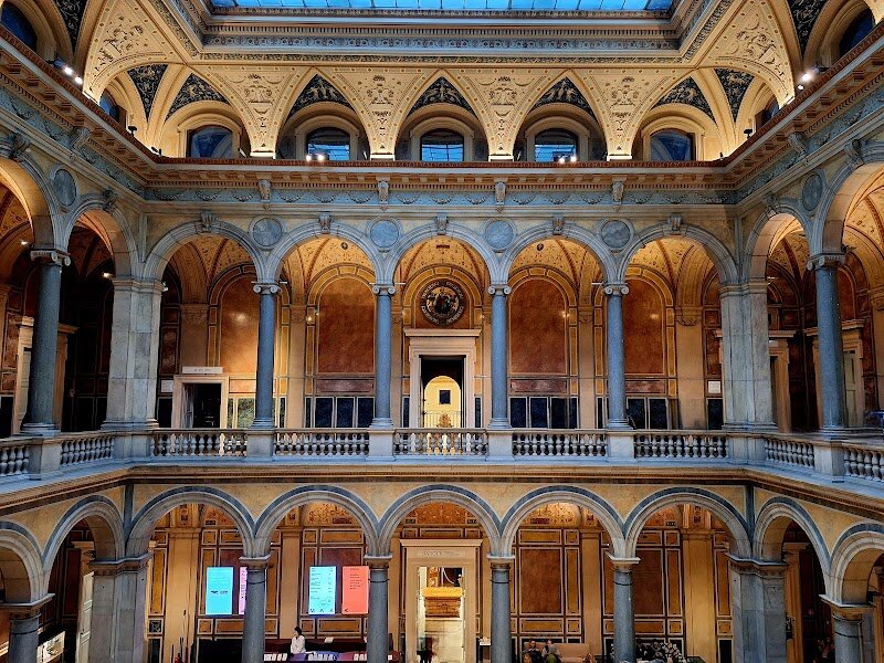 Museum of Applied Arts - Step into the MAK – Vienna’s Museum of Applied Arts – and discover a world where design, history, and creativity come alive. Founded in 1863, this grand institution was inspired by London’s Victoria & Albert Museum and has been shaping the way we see art and everyday objects ever since. Housed in a stunning Italian Renaissance-style building on the Ringstraße, the MAK is as much a masterpiece as the treasures inside. Wander through centuries of design, from Baroque glassware and exquisite Viennese porcelain to avant-garde furniture and fashion. Marvel at the ornate ceilings, the iconic Thonet chair, and the dazzling MAKlite light installation that brings the façade to life at night. The MAK isn’t just about the past – it’s a place where tradition meets innovation, with thought-provoking exhibitions that spark curiosity in visitors of all ages. Whether you’re a design lover, a history buff, or simply looking for inspiration, the MAK offers something special: a journey through beauty, craftsmanship, and the stories behind the objects we use every day. It’s a museum that invites you to look closely, think creatively, and leave with a fresh perspective.