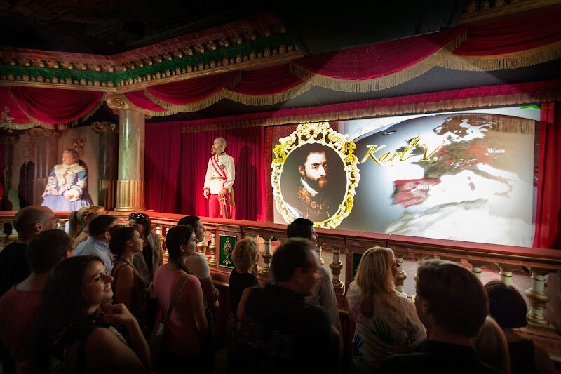 Time Travel Vienna - Step into the vaults of a 400-year-old monastery and embark on an unforgettable journey through two millennia of Viennese history. Time Travel Vienna transforms the underground chambers of St. Michael's Monastery into an immersive wonderland where cutting-edge technology brings the past to vivid life. This isn't your typical museum—it's an interactive adventure featuring eight meticulously crafted stations, each dedicated to pivotal moments and themes in Vienna's story. Experience the grandeur of Roman Vindobona in a spectacular 5D cinema, then encounter animatronic Habsburg emperors and the famous composers Mozart and Strauss in engaging multimedia shows. The tour doesn't shy away from darker chapters, including a haunting recreation of the 17th-century plague and an original World War II air-raid shelter. What truly sets this experience apart is its blend of entertainment and education. Visitors don virtual reality glasses to soar through Vienna's musical heritage, then enjoy a magical virtual carriage ride over the city's iconic landmarks, complete with snow and laser effects. Whether you're a history enthusiast or simply curious about this cultural capital, Time Travel Vienna delivers an unforgettable 50-minute adventure that makes learning genuinely thrilling.