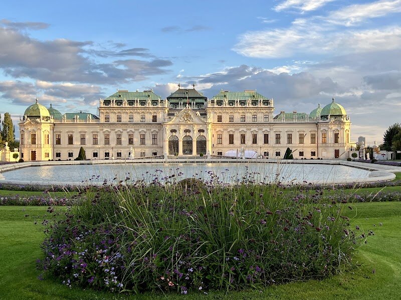 Austrian Gallery Belvedere - The Belvedere stands as one of Vienna's most enchanting treasures, a magnificent Baroque masterpiece that seamlessly blends history, art, and architectural splendor. Built between 1712 and 1723 by Prince Eugene of Savoy, this stunning palace complex was originally designed as a luxurious summer residence, showcasing the prince's military triumphs and refined taste. Today, the Belvedere captivates visitors with its two interconnected palaces—the grand Upper Belvedere and the intimate Lower Belvedere—linked by breathtaking Baroque gardens adorned with fountains, sculptures, and symmetrical pathways. The museum houses an extraordinary collection of nearly 18,600 artworks spanning 900 years, including Gustav Klimt's iconic "The Kiss" and masterpieces by Jacques-Louis David. Beyond the world-class paintings and frescoes, the palaces themselves are works of art, featuring ornate facades, sweeping staircases, and opulently decorated marble halls. Whether you're an art enthusiast, history lover, or simply seeking beauty, the Belvedere offers an unforgettable journey through Austrian culture and European heritage, making it an absolute must-visit destination for curious travelers of all ages.